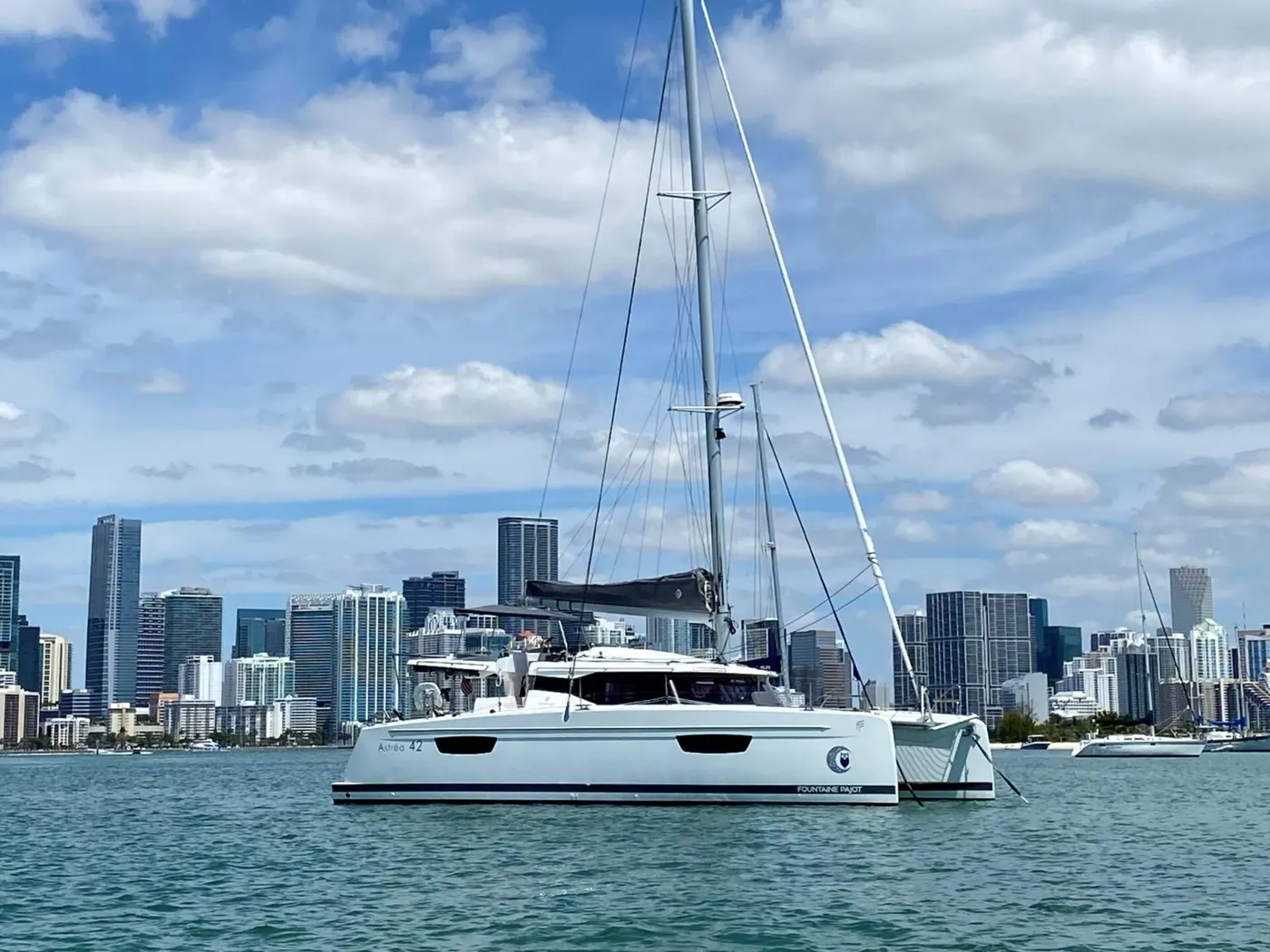 A catamaran on Biscayne Bay against the Miami skyline
